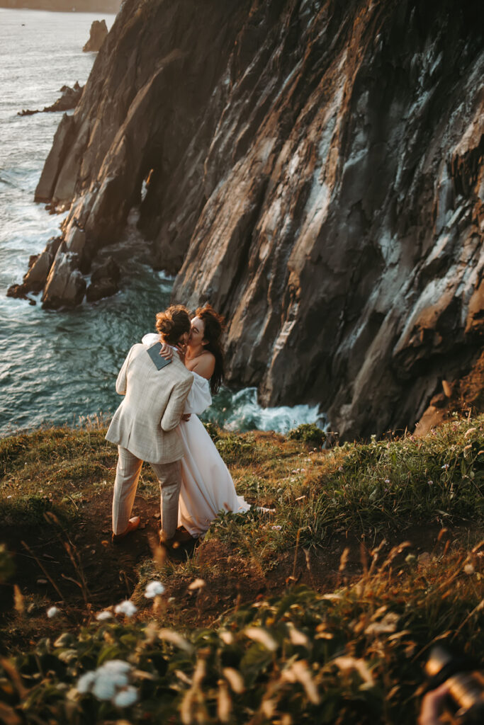 Wedding and Elopement Photography, couple kissing each other on a cliffside